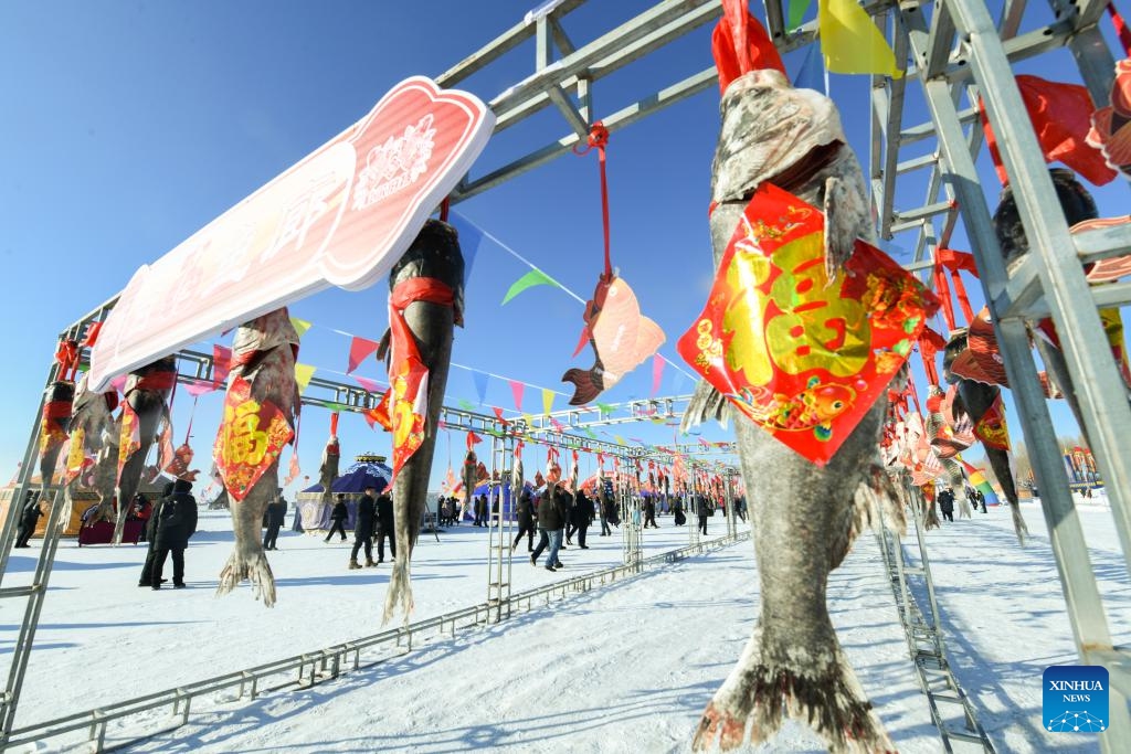 This photo taken on Dec. 27, 2023 shows a winter fishing event on the frozen Lianhuan Lake in Mongolian Autonomous County of Dorbod, Daqing City, northeast China's Heilongjiang Province. The winter fishing event in Heilongjiang Province, featuring more than 25 fishing events across 18 county-level locations, will extend until the end of March of the next year.(Photo: Xinhua)