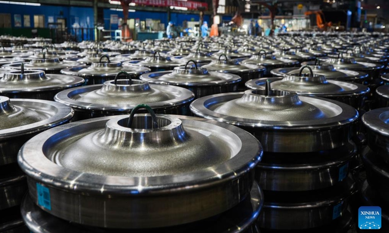 Employees package wheel products at a workshop in China Baowu Group Masteel Rail Transit Materials Technology Co., Ltd. (MRT) in Ma'anshan, east China's Anhui Province, Dec. 15, 2023. (Photo: Xinhua)