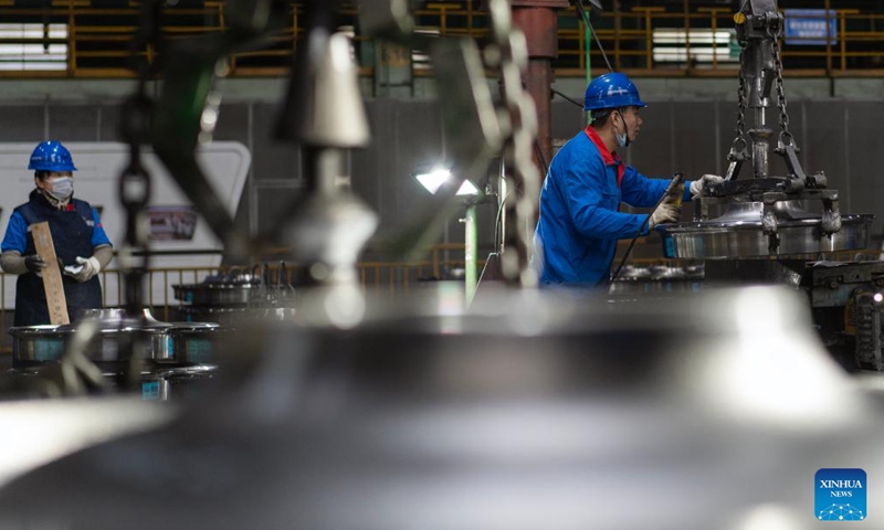 Employees package wheel products at a workshop in China Baowu Group Masteel Rail Transit Materials Technology Co., Ltd. (MRT) in Ma'anshan, east China's Anhui Province, Dec. 15, 2023. (Photo: Xinhua)