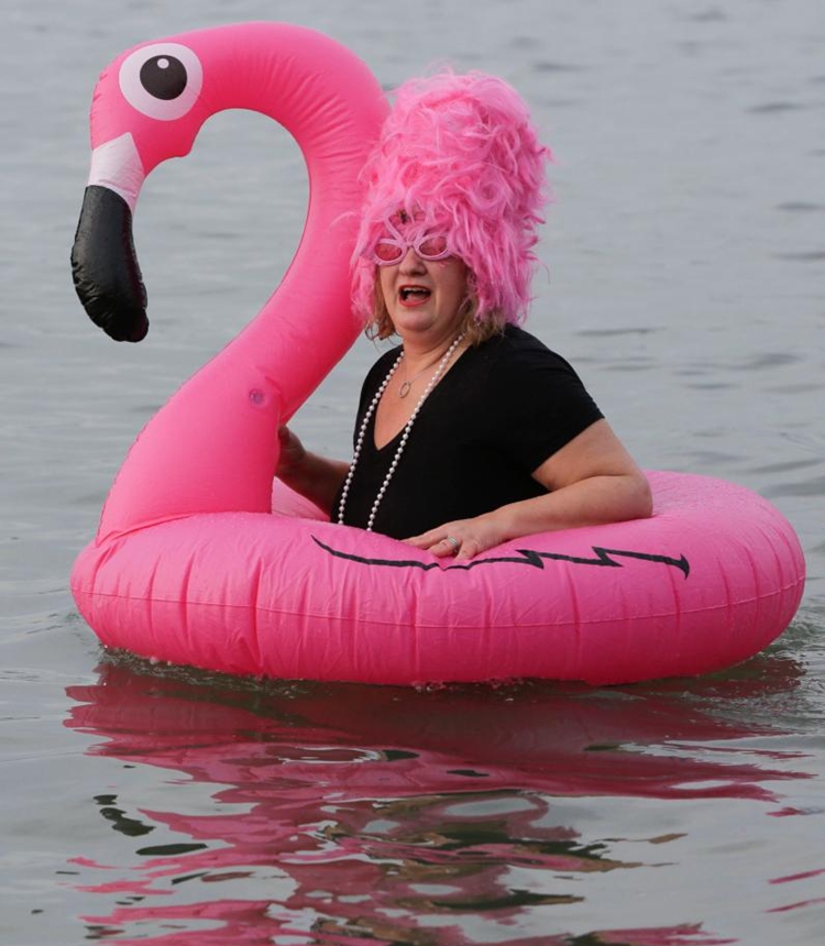 A person in flamingo costume participates in the 104th annual Polar Bear Swim at English Bay in Vancouver, British Columbia, Canada, on Jan. 1, 2024. (Photo: Xinhua)