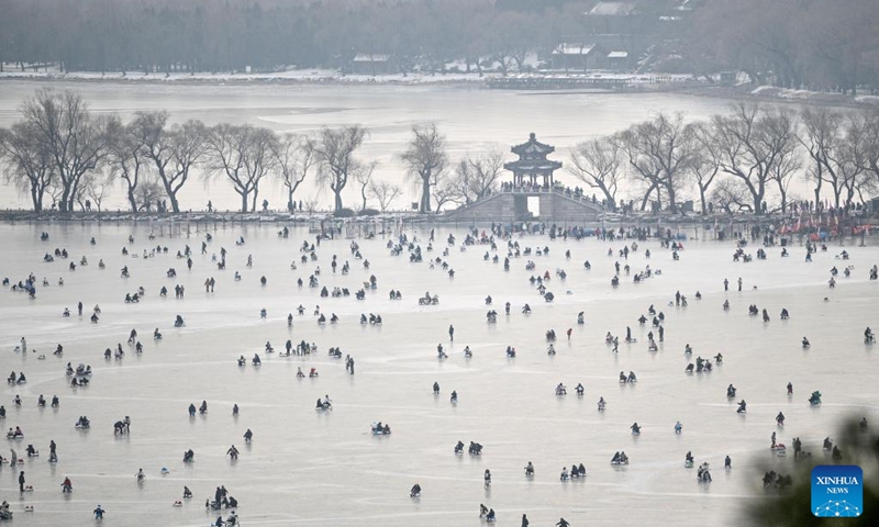 Tourists have fun on a frozen lake at the Summer Palace in Beijing, capital of China, Jan. 1, 2024. (Photo:Xinhua)