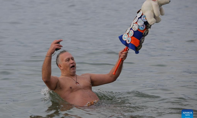 A person takes part in the 104th annual Polar Bear Swim at English Bay in Vancouver, British Columbia, Canada, on Jan. 1, 2024. (Photo: Xinhua)