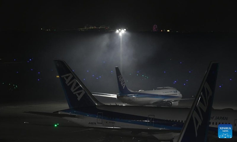 Smoke is seen above a runway of the Haneda Airport after an aircraft collision at the airport in Tokyo, Japan, Jan. 2, 2024.(Photo: Xinhua)