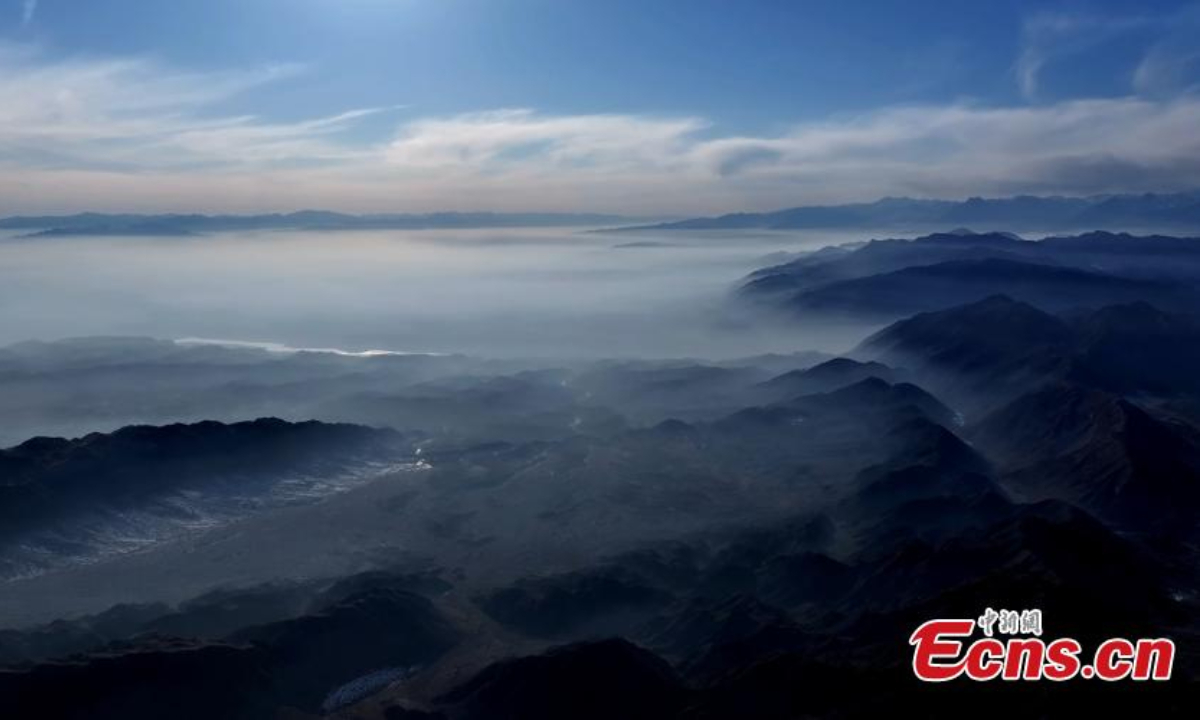 Winter scenery of mist enveloped mountains in Aksu Prefecture, northwest China's Xinjiang Uyghur Autonomous Region. Photo:China News Service