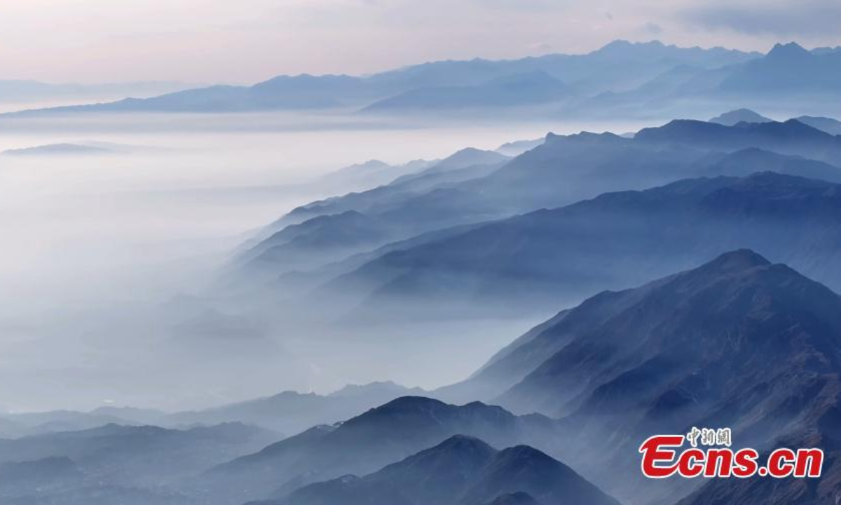 Winter scenery of mist enveloped mountains in Aksu Prefecture, northwest China's Xinjiang Uyghur Autonomous Region. Photo:China News Service