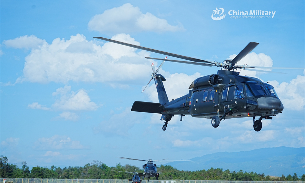 A group of helicopters attached to a brigade of the PLA Army take off for a formation flight training exercise on December 21, 2023. Photo:China Military