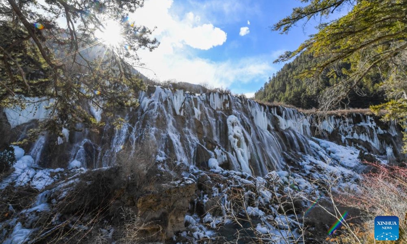 This photo taken on Jan. 4, 2024 shows the frozen Nuorilang Waterfall at the Jiuzhaigou National Park in southwest China's Sichuan Province. An international tourism festival featuring frozen waterfalls opened Thursday at the Jiuzhaigou National Park, a UNESCO World Heritage Site. The national park, also known as the Jiuzhai Valley, contains around 20 tourist sites and is known for its spectacular waterfalls, lush forest, serene plateau lakes, and karst rock formations.(Photo: Xinhua)