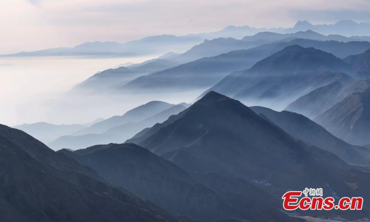 Winter scenery of mist enveloped mountains in Aksu Prefecture, northwest China's Xinjiang Uyghur Autonomous Region. Photo:China News Service