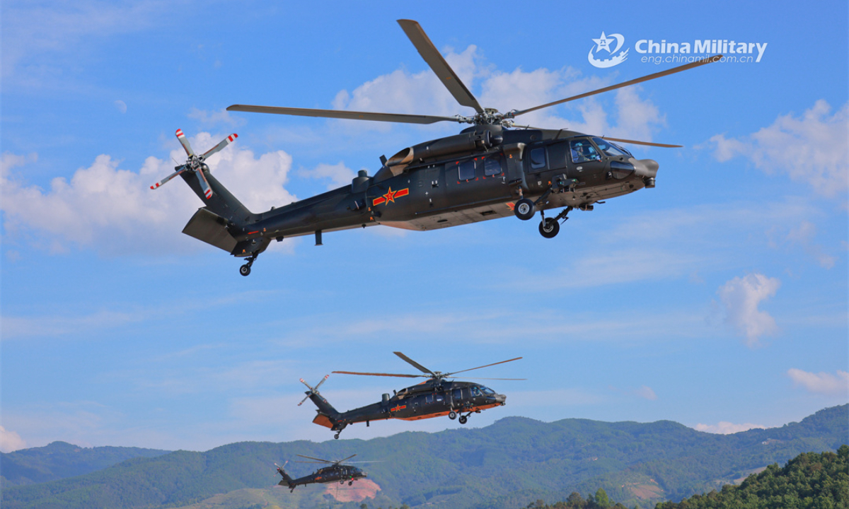 A group of helicopters attached to a brigade of the PLA Army take off for a formation flight training exercise on December 21, 2023. Photo:China Military