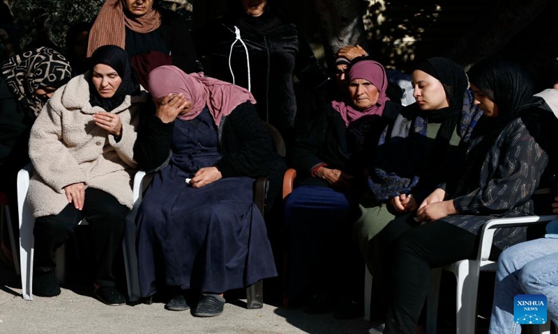 People attend the funeral of a victim in the West Bank city of Jenin, Jan. 7, 2024. Seven Palestinians were killed on Sunday morning by an Israeli drone strike in the occupied West Bank, while an Israeli police officer was killed when her vehicle hit a roadside bomb, Israeli and Palestinian sources said on Sunday.(Photo by Ayman Nobani/Xinhua)