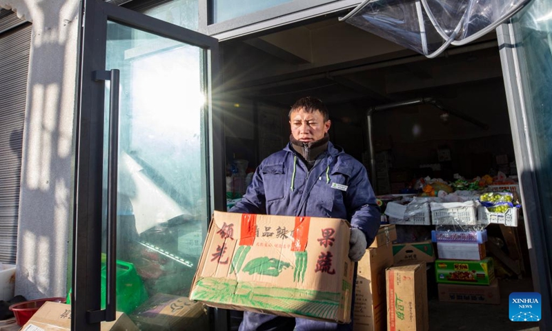 Tsering Samdrup, a distributor of Xainza County's Supply and Marketing Cooperative, prepares goods to be delivered to a direct sales store in the remote Beiga No.4 Village, at the central store in Xainza County, southwest China's Xizang Autonomous Region, Jan. 5, 2024. The Xainza County in Nagqu City, southwest China's Xizang Autonomous Region, situated at an average elevation of 4,700 meters. Traditionally, local herders' diet relies on meat and tea, lacking fruits and vegetables.(Xinhua/Cao Bin)