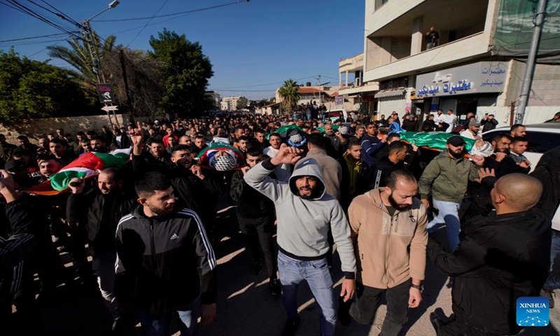 People attend the funeral of a victim in the West Bank city of Jenin, Jan. 7, 2024. Seven Palestinians were killed on Sunday morning by an Israeli drone strike in the occupied West Bank, while an Israeli police officer was killed when her vehicle hit a roadside bomb, Israeli and Palestinian sources said on Sunday.(Photo by Ayman Nobani/Xinhua)