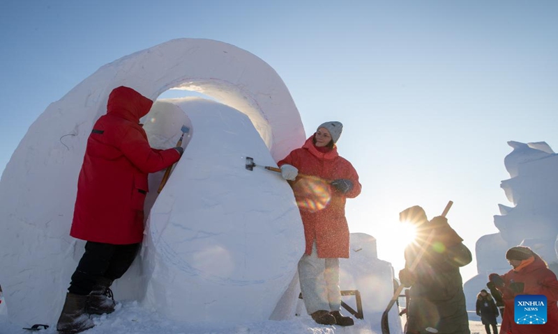 Contestants work on a snow sculpture at the Sun Island scenic area in Harbin, northeast China's Heilongjiang Province, Jan. 7, 2024. An international snow sculpture competition is held here, attracting snow sculptors from 12 countries. (Xinhua/Zhang Tao)