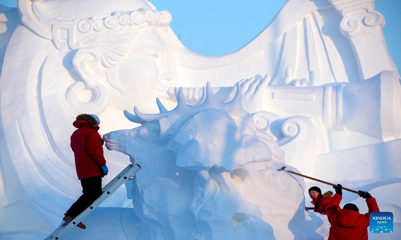 Contestants work on a snow sculpture at the Sun Island scenic area in Harbin, northeast China's Heilongjiang Province, Jan. 7, 2024. An international snow sculpture competition is held here, attracting snow sculptors from 12 countries. (Xinhua/Zhang Tao)