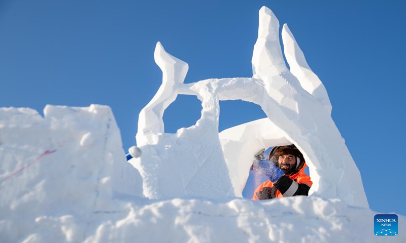 A contestant works on a snow sculpture at the Sun Island scenic area in Harbin, northeast China's Heilongjiang Province, Jan. 7, 2024. An international snow sculpture competition is held here, attracting snow sculptors from 12 countries. (Xinhua/Wang Dayu)