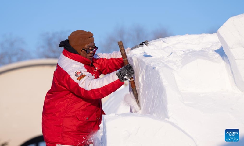 A contestant works on a snow sculpture at the Sun Island scenic area in Harbin, northeast China's Heilongjiang Province, Jan. 7, 2024. An international snow sculpture competition is held here, attracting snow sculptors from 12 countries. (Xinhua/Wang Dayu)