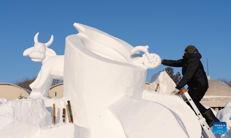 A contestant works on a snow sculpture at the Sun Island scenic area in Harbin, northeast China's Heilongjiang Province, Jan. 7, 2024. An international snow sculpture competition is held here, attracting snow sculptors from 12 countries. (Xinhua/Wang Dayu)