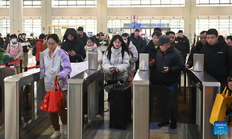 Passengers check in at Xinchang Railway Station in Shengzhou, east China's Zhejiang Province, Jan. 8, 2024. The Hangzhou-Shaoxing-Taizhou intercity railway, China's first high-speed railway controlled by private capital, celebrated its 2nd anniversary of operation Monday. With a designed speed of 350 kilometers per hour, the railway has delivered a total of 20 million passengers since it started operation. (Photo: Xinhua)