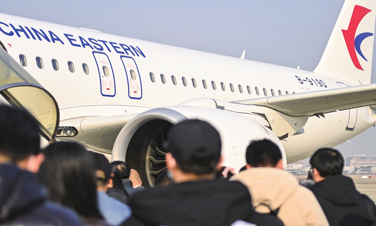 Passengers prepare to board China's home-made C919 aircraft on January 9, 2024. The plane departed from Shanghai Hongqiao International Airport to Beijing Daxing International Airport. It is the second route after Shanghai-Chengdu service. Photo: Courtesy of China Eastern Airlines