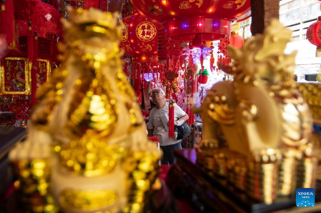 A woman shops for decorations at Pancoran Glodok in Jakarta, Indonesia, Jan. 9, 2024.(Photo: Xinhua)