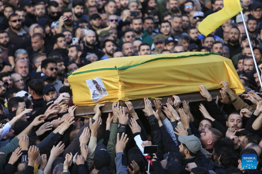 People attend a funeral of a Hezbollah military member killed in an Israeli airstrike, in Kherbet Selem, Lebanon, on Jan. 9, 2024. The confrontations between Hezbollah and Israel have killed 211 on the Lebanese side, including 154 Hezbollah members and 35 civilians, according to Lebanese security sources.(Photo: Xinhua)