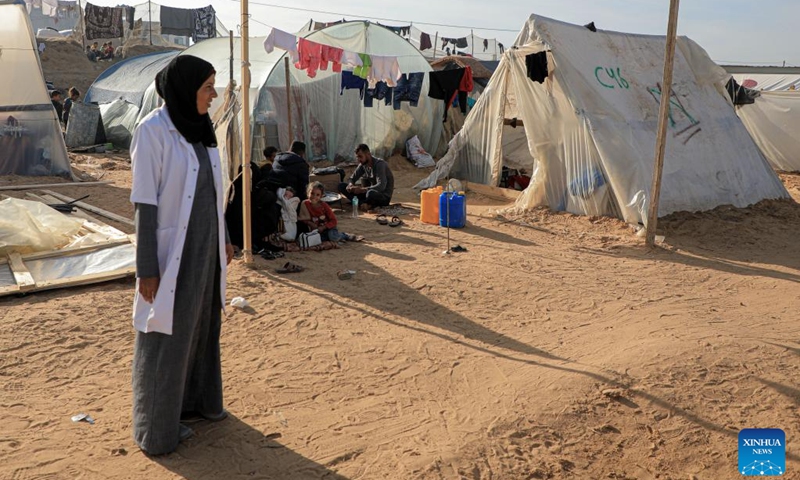 A doctor is seen at a temporary clinic in the southern Gaza Strip city of Rafah, on Jan. 8, 2024. Israel has been fighting with Hamas in the Gaza Strip since Oct. 7, 2023, after the Palestinian faction launched a surprise attack on southern Israel that killed about 1,200 people. The Israeli army has so far killed more than 23,000 Palestinians in its military operations in the enclave, the Gaza-based Health Ministry said Monday.(Photo: Xinhua)