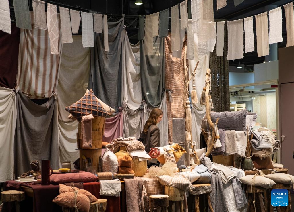 A visitor walks past textile samples at the Heimtextil 2024 in Frankfurt, Germany, Jan. 9, 2024. Heimtextil 2024, an international platform for home and contract textiles and textile design, kicked off Tuesday in Frankfurt.(Photo: Xinhua)