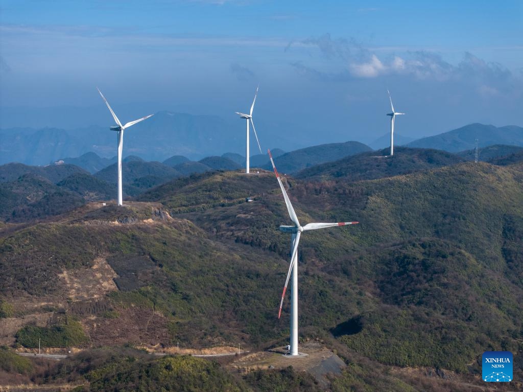 An aerial drone photo taken on Jan. 10, 2024 shows wind turbines in Liutang Township of Shizhu Tujia Autonomous County, southwest China's Chongqing. The installed capacity of wind power and power generation from wind in Shizhu have reached 372,000 kW and 731 million kWh respectively.(Photo: Xinhua)