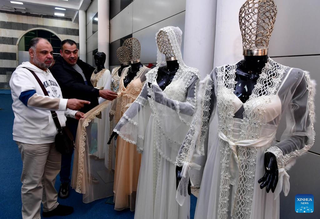 People attend the Syrian fashion expo in Damascus, Syria, on Jan. 11, 2024. The Syrian fashion expo, Motex Khan Al-Hareer, a textile, clothing and production tools fair, kicked off here on Thursday. (Photo: Xinhua)