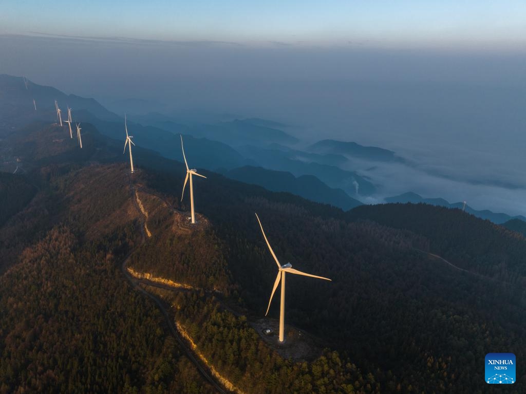 An aerial drone photo taken on Jan. 10, 2024 shows wind turbines in Yuchi Town of Shizhu Tujia Autonomous County, southwest China's Chongqing. The installed capacity of wind power and power generation from wind in Shizhu have reached 372,000 kW and 731 million kWh respectively.(Photo: Xinhua)