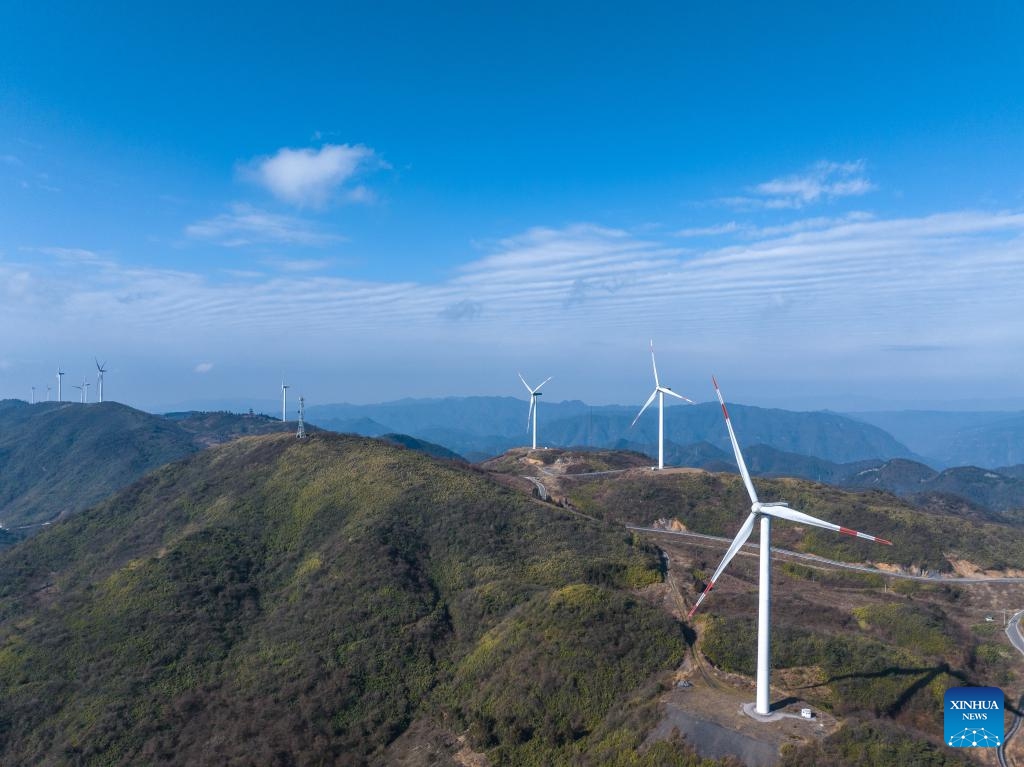 An aerial drone photo taken on Jan. 10, 2024 shows wind turbines in Liutang Township of Shizhu Tujia Autonomous County, southwest China's Chongqing. The installed capacity of wind power and power generation from wind in Shizhu have reached 372,000 kW and 731 million kWh respectively.(Photo: Xinhua)