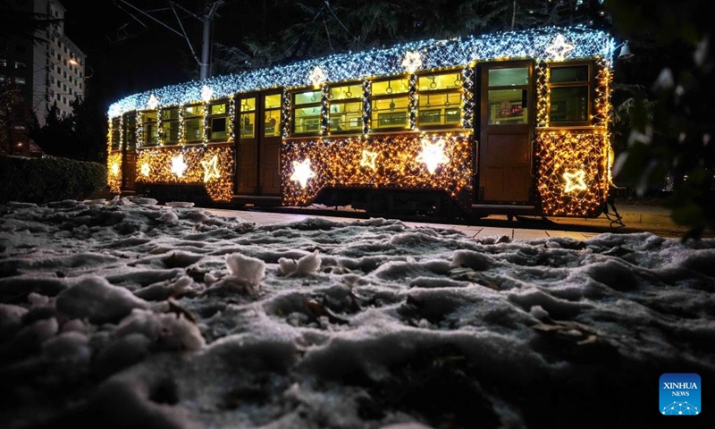 A tram decorated with lights is seen in Dalian, northeast China's Liaoning Province, Jan. 9, 2024. Since Dec. 31, 2023, several trams in Dalian have been decorated with lights in order to attract more tourists. The history of tram in Dalian City dates back to 1909.(Photo: Xinhua)