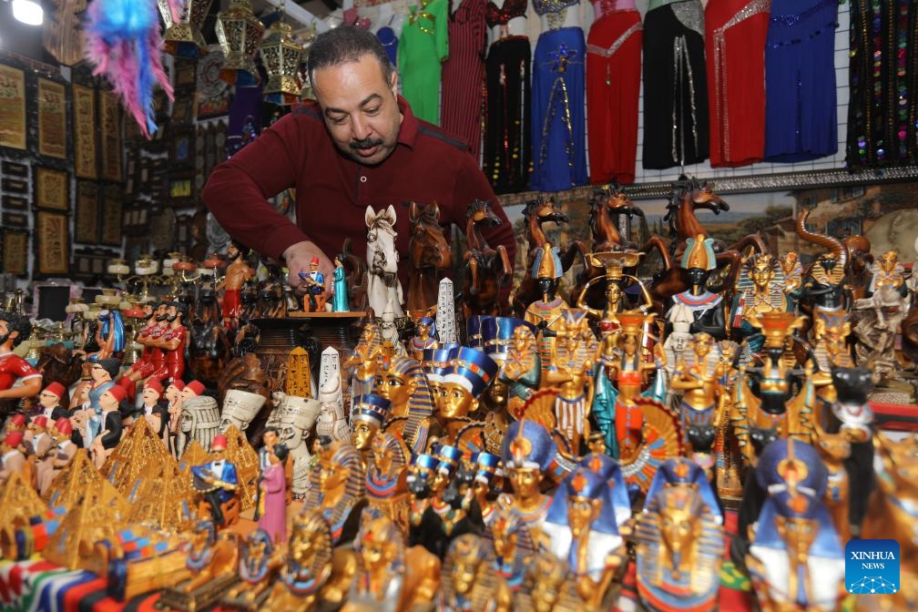 An exhibitor arranges products during the 47th session of the Baghdad International Fair in Baghdad, Iraq, on Jan. 11, 2024. More than 800 Iraqi and foreign companies from about 20 countries participated the event, which opened on Jan. 10 and will last until Jan. 19.(Photo: Xinhua)