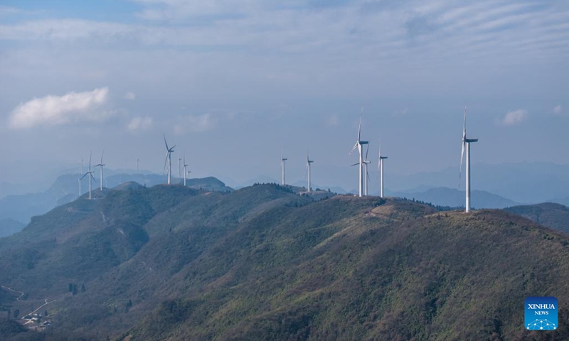 An aerial drone photo taken on Jan. 10, 2024 shows wind turbines in Liutang Township of Shizhu Tujia Autonomous County, southwest China's Chongqing. The installed capacity of wind power and power generation from wind in Shizhu have reached 372,000 kW and 731 million kWh respectively.(Photo: Xinhua)