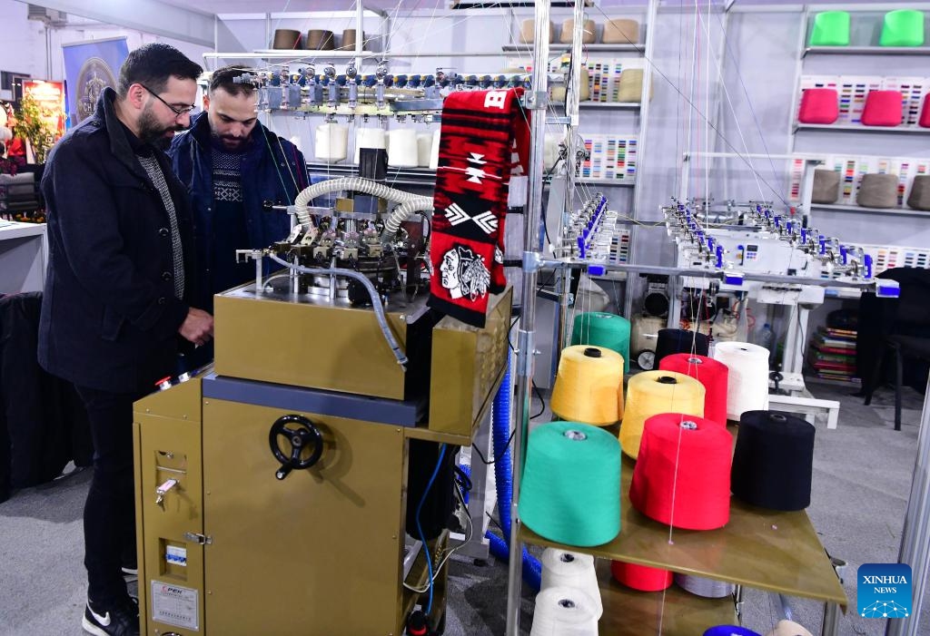 People attend the Syrian fashion expo in Damascus, Syria, on Jan. 11, 2024. The Syrian fashion expo, Motex Khan Al-Hareer, a textile, clothing and production tools fair, kicked off here on Thursday. (Photo: Xinhua)