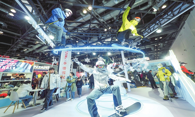 Consumers shop for skiing products at the ISPO Beijing 2024, a multi-segment sports exhibition in Asia, on December 14, 2023. The exhibition attracted nearly 500 exhibitors and about 700 brands. China has been developing winter sports and related industries, with the ice-and-snow industry estimated to have reached 890 billion yuan ($125.17 billion) in 2023. Photo: VCG