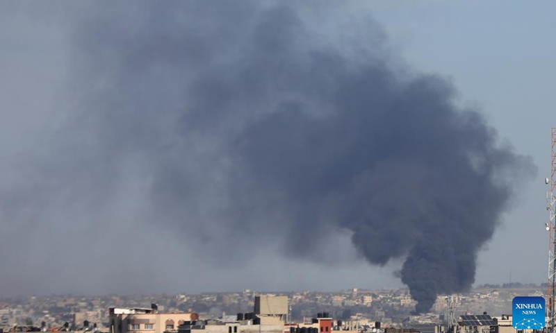 Smoke rises following an Israeli airstrike in the southern Gaza Strip city of Khan Younis, Jan. 13, 2024. According to statistics issued by the Gaza-based Health Ministry on Saturday, the Israeli attacks on the Gaza Strip killed 135 and wounded 312 others during the past 24 hours. (Photo by Yasser Qudih/Xinhua)