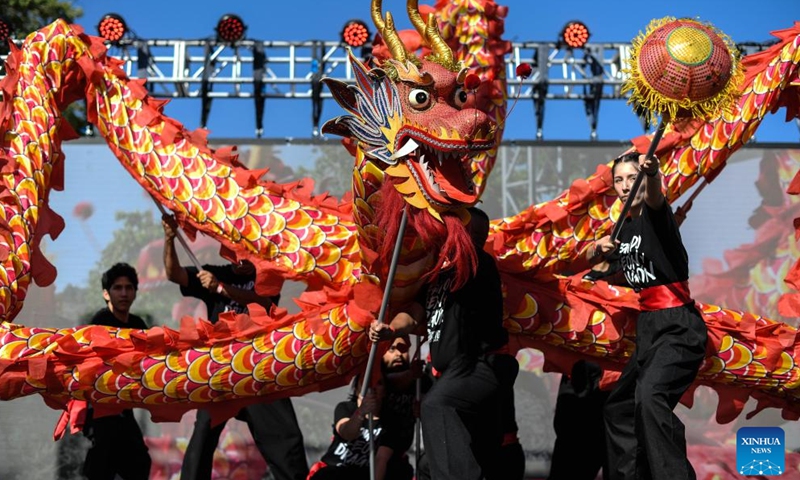 Performers play a dragon dance during an event to greet the upcoming Spring Festival in Santiago, Chile, Jan. 13, 2024. (Photo by Jorge Villegas/Xinhua)