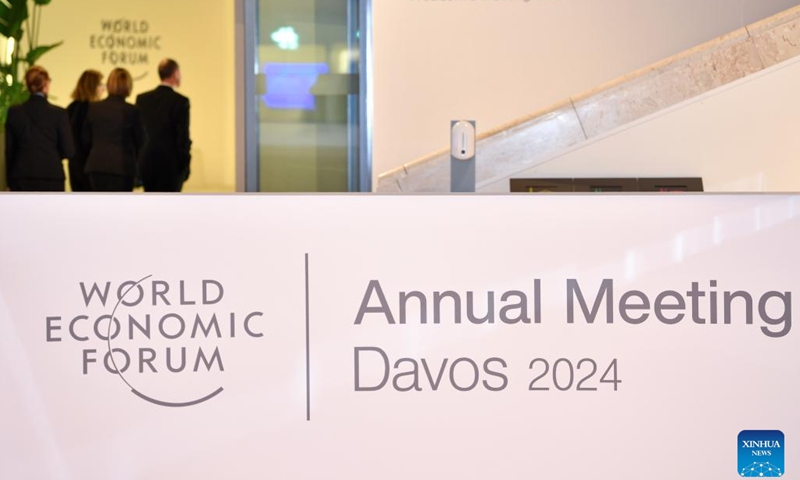 People walk at the Congress Center for the World Economic Forum (WEF) Annual Meeting 2024 in Davos, Switzerland, Jan. 14, 2024. On the theme of Rebuilding Trust, the 54th WEF Annual Meeting will take place here from Jan. 15 to Jan. 19. The main topics at the forum range from achieving security and cooperation in a divided world, creating jobs and growth for a new era to a long-term strategy for climate, nature and energy. (Xinhua/Lian Yi)