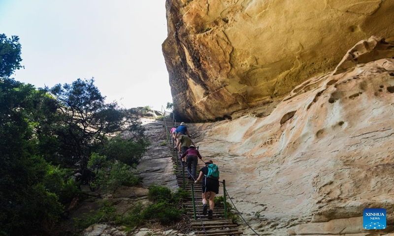 Tourists visit the Golden Gate Highlands National Park in Free State province, South Africa, Jan. 14, 2024. Located in the northeastern part of Free State province, Golden Gate Highlands National Park derives its name from the shades of gold cast by the sun on the sandstone cliffs. (Xinhua/Zhang Yudong)