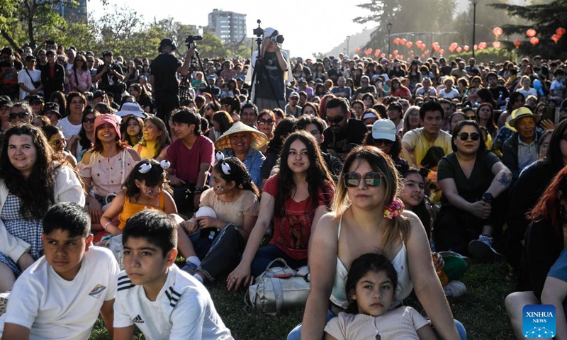 People watch a show during an event to greet the upcoming Spring Festival in Santiago, Chile, Jan. 13, 2024. (Photo by Jorge Villegas/Xinhua)