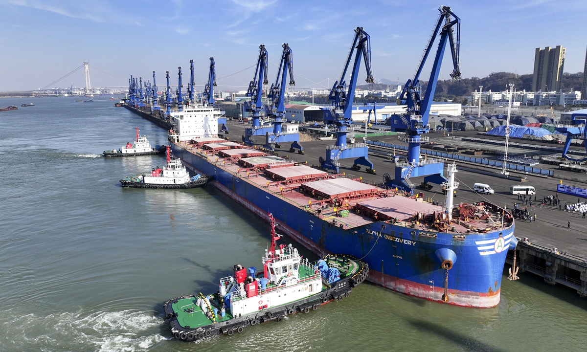 The Alpha Discovery, a Liberia bulk ship carrying 56,000 tons of food, berths at the Nanjing Port in Nanjing, East China's Jiangsu Province on January 15, 2024. The draft of the ship is 11.6 meters, the deepest for a ship to reach in the river port, which will further elevate the Nanjing Port's competitiveness and accelerate the high-quality development of the Yangtze River Economic Belt. Photo: cnsphoto