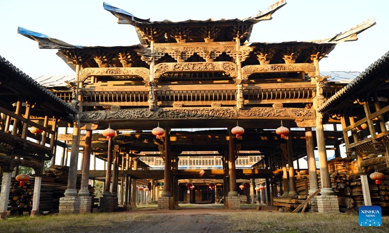 A Huizhou-style antique building is pictured in Huangshan City, east China's Anhui Province, Jan. 11, 2024. Huangshan has boosted construction service specialized in Huizhou-style antique buildings in an innovative way, attracting many enterprises and talents to engage in the industry. Up to now, there are 254 enterprises and over 14,000 craftsmen involved, who specialize in erecting antique buildings, renovating ancient buildings and preparing materials and components for these buildings. (Xinhua/Zhou Mu)