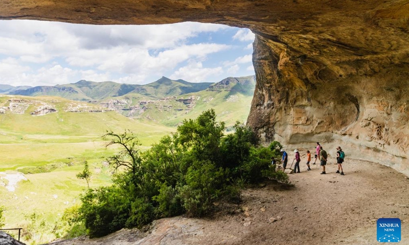 Tourists are seen in a cave in Golden Gate Highlands National Park in Free State province, South Africa, Jan. 14, 2024. Located in the northeastern part of Free State province, Golden Gate Highlands National Park derives its name from the shades of gold cast by the sun on the sandstone cliffs. (Xinhua/Zhang Yudong)