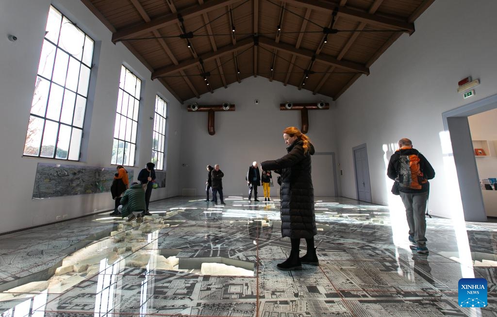 Visitors take a tour in the Museum of Forma Urbis in Rome, Italy, Jan. 16, 2024. The Museum of the Forma Urbis, enclosed within a new archaeological park, opened to the public recently. The museum houses the remaining fragments of the Forma Urbis Romae, the giant marble map of ancient Rome engraved between 203 and 211 AD. Epigraphic and architectural artifacts are showcased within the archaeological park, providing free access for both citizens and tourists.(Photo: Xinhua)