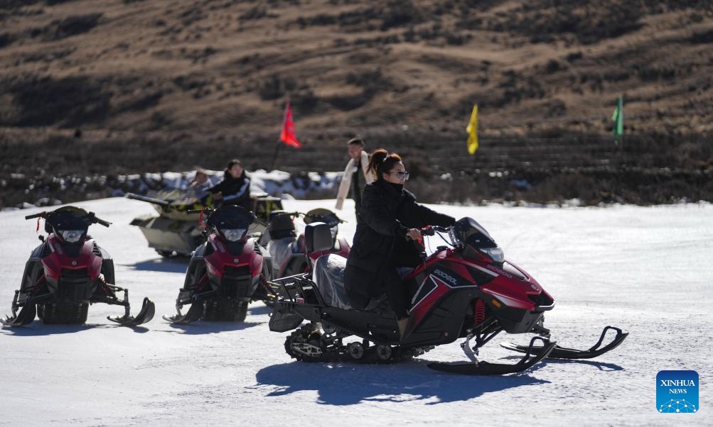 Visitors experience motorcycle riding at the first ski resort of Xizang in Lhalung Village, Maizhokunggar County, southwest China's Xizang Autonomous Region, Jan. 13, 2024. The vast land of southwest China's Xizang Autonomous Region celebrated the opening of its first ski resort this snow season, with the resort established at an elevation of 4,500 meters just 120 km away from the Lhasa city center.(Photo: Xinhua)