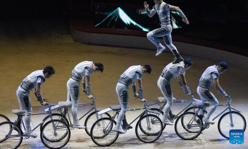 Members of the China National Acrobatic Troupe perform a bicycle act during the gala show of the 15th Budapest International Circus Festival held in Budapest, Hungary on Jan. 15, 2024. The China National Acrobatic Troupe won gold prize and Budapest Grand Prix at the 15th Budapest International Circus Festival here on Monday.(Photo: Xinhua)