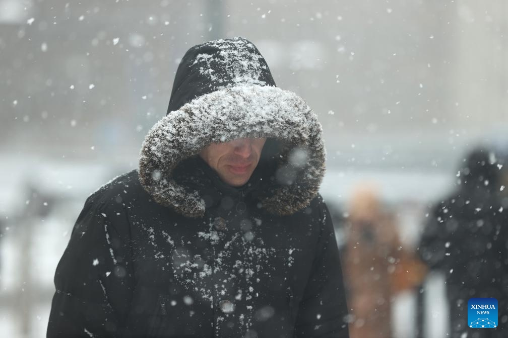 People walk in the snow in Brussels, Belgium, Jan. 17, 2024.(Photo: Xinhua)