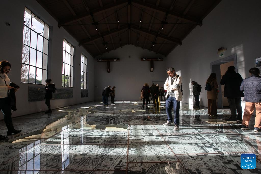 Visitors take a tour in the Museum of Forma Urbis in Rome, Italy, Jan. 16, 2024. The Museum of the Forma Urbis, enclosed within a new archaeological park, opened to the public recently. The museum houses the remaining fragments of the Forma Urbis Romae, the giant marble map of ancient Rome engraved between 203 and 211 AD. Epigraphic and architectural artifacts are showcased within the archaeological park, providing free access for both citizens and tourists.(Photo: Xinhua)