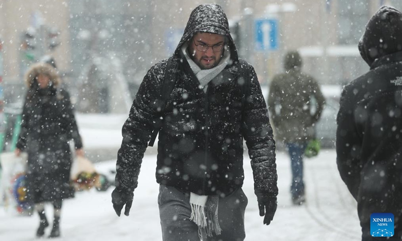 People walk in the snow in Brussels, Belgium, Jan. 17, 2024.(Photo: Xinhua)